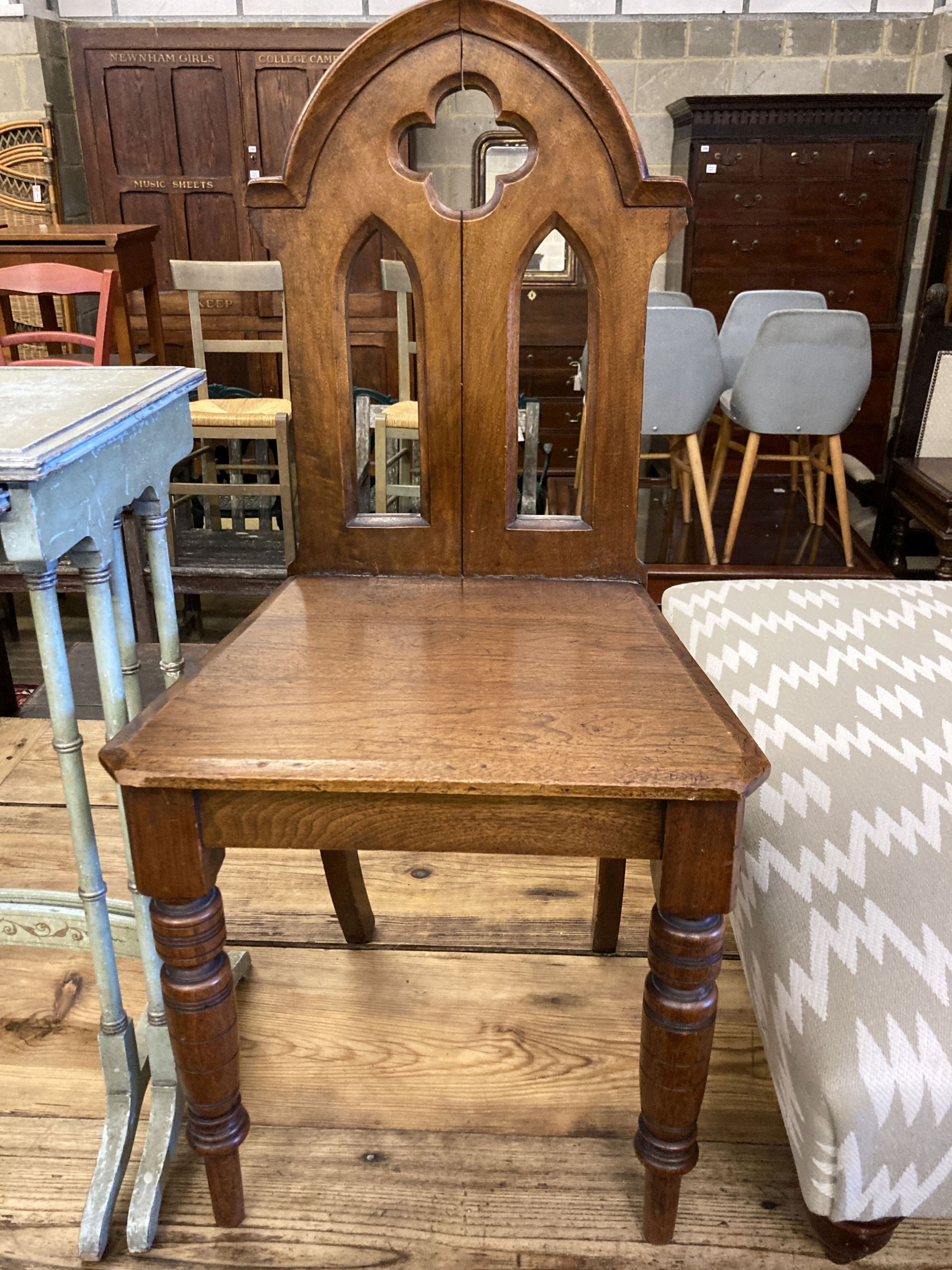 A nest of two painted rectangular tea tables and a Victorian Gothic style walnut hall chair